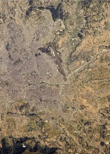 Kathmandu Valley, surrounded by green, vegetated slopes, seen from the Nasa Earth Observatory.