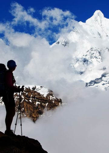A hiker on the trek in the Himalayas, Annapurna Valley, Nepal. Photo: Kapulya/Canva